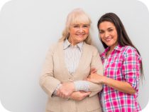 A woman and an older lady posing for the camera.